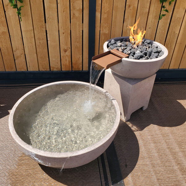 Modern fire and water feature set with a sleek GFRC concrete finish, combining a stunning flame display with a cascading water element, perfect for luxurious outdoor living spaces.