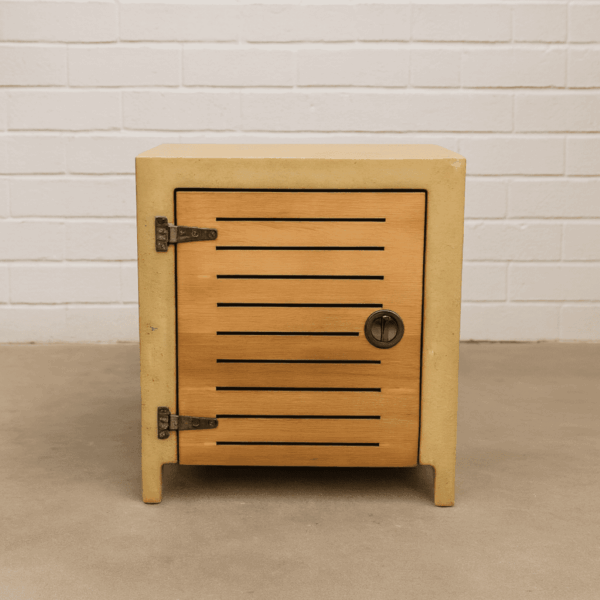 Square concrete propane tank enclosure with ventilation, designed to match outdoor fire tables.