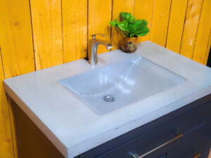 Concrete wave vanity sink with flowing sculpted basin by Castin Crete Designs