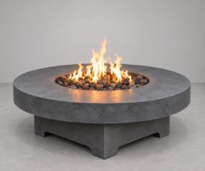 Solara round GFRC concrete fire table by Castin Crete Designs — circular pedestal base with lava rock media, handcrafted in Hartland, Wisconsin