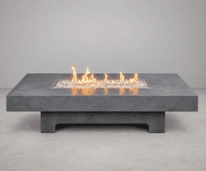 Strata GFRC concrete fire table by Castin Crete Designs — low rectangular form with linear burner, handcrafted in Hartland, Wisconsin
