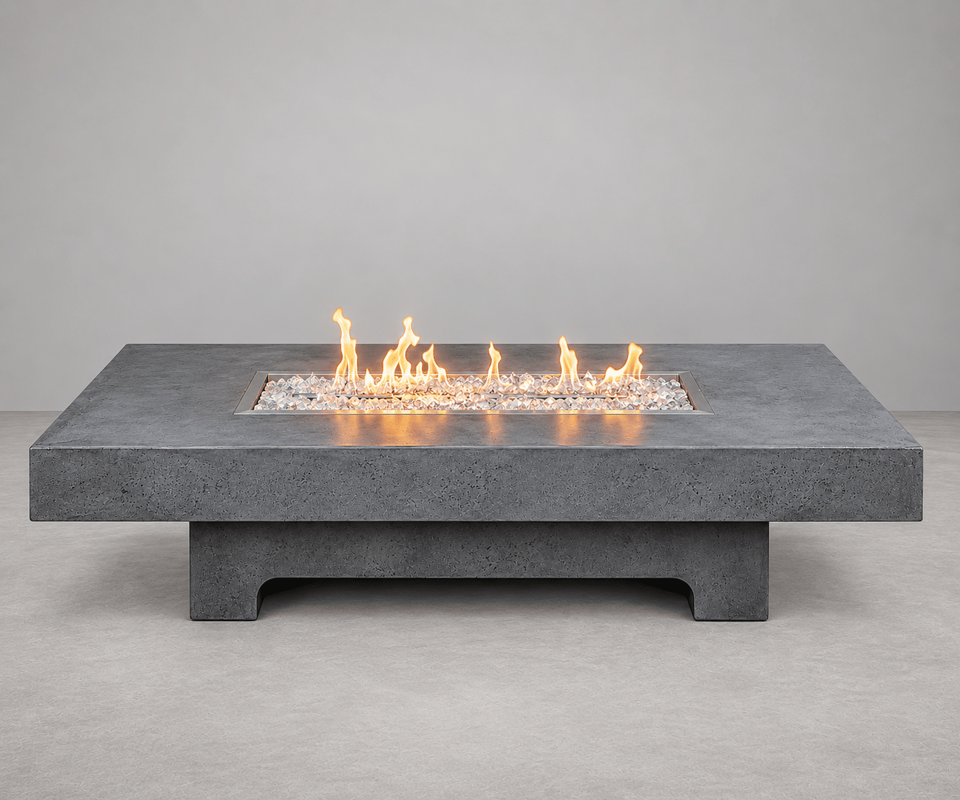 Strata GFRC concrete fire table by Castin Crete Designs — low rectangular form with linear burner, handcrafted in Hartland, Wisconsin